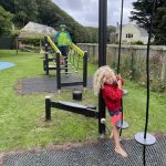 girl play on trim trail in park