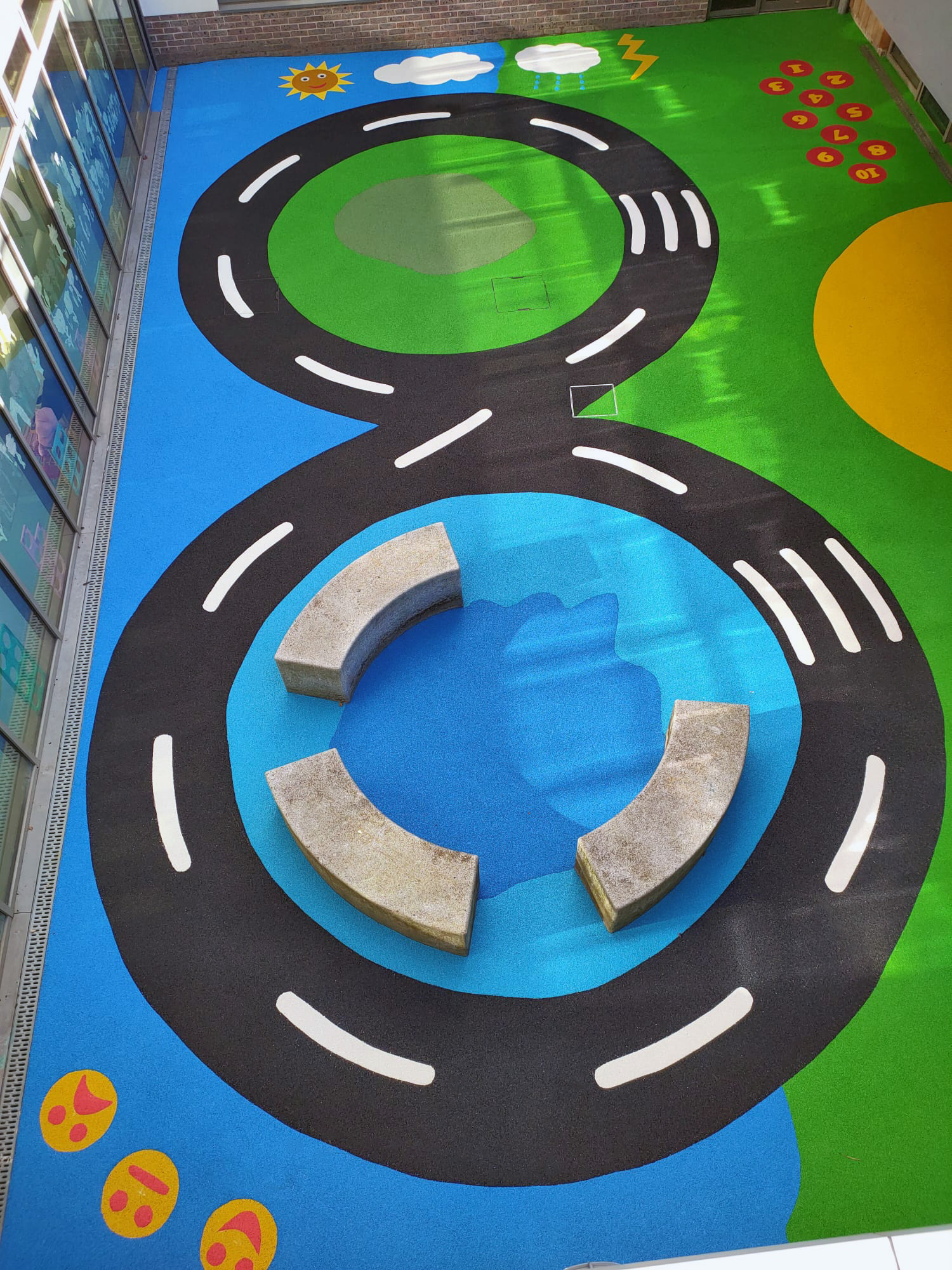 Skilled installation of wet pour rubber by Adventure Playgrounds Wales