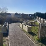 Rubber mulch path with planters at South Wales school