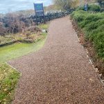 Long Tigermulch pathway winding through trees
