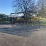 Basket and flat swing on safety surfacing