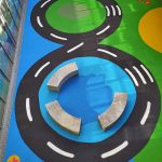 Looping road design with coloured play zones